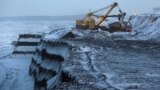 RUSSIA -- An excavator loads wagons with coal at Russia's largest Borodinsky opencast colliery, owned by the Siberian Coal Energy Company (SUEK), near the Siberian town of Borodino, Krasnoyarsk region, Russia, November 29, 2017. Picture taken November 29,