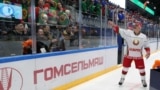 BELARUS -- Belarusian President Alyaksandr Lukashenka throws a toy to spectators after an amateur ice hockey game, as competitions in Belarus continue despite the rest of major sports events were shut down because of the outbreak of coronavirus disease (C