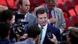 U.S. -- President Donald Trump's Campaign Chairman Paul Manafort is surrounded by reporters on the floor of the Republican National Convention in Cleveland, July 17, 2016
