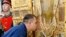 RUSSIA -- A serviceman kisses the main icon for the Russian Armed Forces' main cathedral, delivered at the Church of Our Lady the Healer, in Rostov-on-Don, May 15, 2019