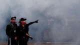 CHINA -- Anti-government protesters react from tear gas during a demonstration near Central Government Complex in Hong Kong, China September 15, 2019.