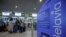 RUSSIA -- Passengers queue near a check-in desk to register for a flight of Belavia Belarusian Airlines heading to Minsk at the Domodedovo Airport outside Moscow, May 28, 2021