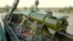 Russia -- A rocket is loaded into an Iskander-M missile launcher during a military training in the Astrakhan region, May 20, 2015