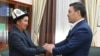 Altynbek Jumataev, father of slain 2020 protester Umutbek Altynbek ulu, meets Kyrgyz President Sadyr Japarov on October 5, 2021.