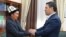 Altynbek Jumataev, father of slain 2020 protester Umutbek Altynbek ulu, meets Kyrgyz President Sadyr Japarov on October 5, 2021.