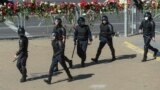 BELARUS -- Belarusian police pass the site where a protester died last night in Minsk, August 11, 2020