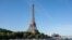 A peniche boat sails past the Eiffel Tower on the River Seine on July 17, 2023, during a parade to test "maneuvers", "distances", "duration" and "video capture" of the future opening ceremony of the Paris Olympics in 2024.