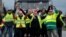 FRANCE - Protesters wearing yellow vests, the symbol of a French drivers' protest against higher diesel fuel prices, occupy a roundabout in Gaillon, France, December 6, 2018