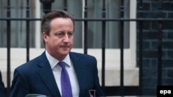 U.K. - Britain's Prime Minister David Cameron leaves Number 10 Downing Street in central London, 26 September 2014