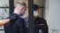 Ivan Safronov is taken to Moscow's Lefortovsky District Court -- Valery Sharifulin/TASS  Россия. Москва. Советник генерального директора Роскосмоса по информационной политике Иван Сафронов (слева), задержанный по подозрению в государственной измене, у Леф