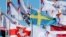LATVIA -- A historical white-red-white flag of Belarus flies next to national flags of nations participating in IIHF World Ice Hockey Championships in Riga, May 24, 2021