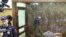 MOSCOW, RUSSIA - Kristina (in a glass cage), one of the Khachaturyan sisters charged with the murder of their father, during a hearing at Moscow's Ostankinsky District Court