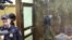 MOSCOW, RUSSIA - Kristina (in a glass cage), one of the Khachaturyan sisters charged with the murder of their father, during a hearing at Moscow's Ostankinsky District Court