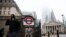 People exit Bank station in the City of London financial district, amid the coronavirus disease (COVID-19) outbreak, in London, Britain, March 4, 2021.