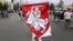 BELARUS – A protester covered himself by an old Belarusian national flag attends an opposition supporters rally in Minsk, September 6, 2020