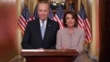U.S. -- U.S. Speaker of the House Nancy Pelosi and Senate Minority Leader Chuck Schumer pose for photographers after concluding their joint response, to President Trump's prime time address, on Capitol Hill in Washington, U.S., January 8, 2019