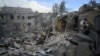 Ukrainian rescuers clear debris on the site of a Russian missile strike in Dnipro, eastern Ukraine, on October 26, 2024, amid the Russian invasion of Ukraine.