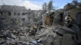 Ukrainian rescuers clear debris on the site of a Russian missile strike in Dnipro, eastern Ukraine, on October 26, 2024, amid the Russian invasion of Ukraine.