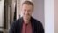 GERMANY -- Russian opposition politician Aleksei Navalny smiles during an interview with prominent Russian YouTube blogger Yury Dud, in Berlin, in this still image taken from a handout video released October 6, 2020