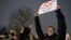 Moscow, Russia - A man holds a placard that reads: "Our hearts demand changes" during a rally in support of jailed Russian opposition leader Alexei Navalny