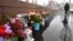 RUSSIA -- People lay flowers at the site where late opposition leader Boris Nemtsov was fatally shot on a bridge near the Kremlin, in central Moscow, February 27, 2020