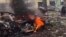 UKRAINRE – A view shows cars and a building of a hospital destroyed by an aviation strike amid Russia's invasion of Ukraine, in Mariupol, Ukraine, in this handout picture released March 9, 2022