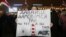 BELARUS – A woman holds a placard reading 'Let's agree like that, we are here but you there!' during a rally against the deepening of Belarus-Russia integration in Minsk, December 20, 2019