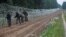 Poland -- Polish soldiers build a fence on the border between Poland and Belarus near the village of Nomiki, Poland August 26, 2021