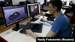 A programmer for Game Stream, a branch of video game company Wargaming, at work in Minsk in 2016.