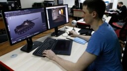 A programmer for Game Stream, a branch of video game company Wargaming, at work in Minsk in 2016.