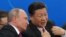 CHINA -- Russian President Vladimir Putin (L) and Chinese President Xi Jinping attend an ice hockey friendly game between junior teams in Tianjin, June 8, 2018