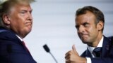 FRANCE - French President Emmanuel Macron and U.S. President Donald Trump react during a news conference at the end of the G7 summit in Biarritz, France, August 26, 2019