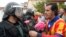 SPAIN -- A man gives a carnation to a Spanish Guardia Civil guard in Sant Julia de Ramis, on October 1, 2017, on the day of a referendum on independence for Catalonia banned by Madrid.