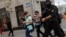 Law enforcement officers are shown detaining journalists in a photograph taken by a Reuters photographer just moments before his own detention in Minsk on July 28.