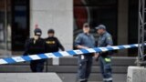 Sweden -- Police officers work at the scene where a truck crashed into the Ahlens department store at Drottninggatan in central Stockholm, April 7, 2017