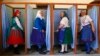 Hungary -- Elderly Hungarian women cast their ballots inside a polling station during parliamentary elections in Veresegyhaza near Budapest April 6, 2014. Hungarians were set to return Prime Minister Viktor Orban to power for another four years in a parli