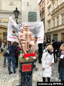 Protesters in the EU city of Prague take aim at Russian President Vladimir Putin and Alyaksandr Lukashenka over the migrant crisis.