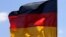 GERMANY – The flags of (L-R) Germany, Ukraine and Europe flutter in front of the Chancellery in Berlin, where Ukraine's new President Volodymyr Zelensky is expected for his first official visit to Germany on June 18, 2019