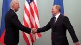 RUSSIA -- Then U.S. Vice President Joe Biden (L) shakes hands with then Russian Prime Minister Vladimir Putin during their meeting in Moscow, March 10, 2011