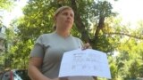Kazakhstan -- Darya Vasilyeva, whose preterm-born daughter was left in Turkey, shows documents on August 13, 2018