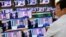 South Korea - A sales assistant watches TV sets broadcasting a news report on North Korea's fifth nuclear test, in Seoul, South Korea, September 9, 2016