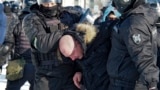 RUSSIA -- Police detain a man during a protest against the jailing of opposition leader Alexei Navalny in Khabarovsk, 6,100 kilometers (3,800 miles) east of Moscow, Russia, Saturday, Jan. 23, 2021. Authorities in Russia have taken measures to curb protest