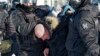 RUSSIA -- Police detain a man during a protest against the jailing of opposition leader Alexei Navalny in Khabarovsk, 6,100 kilometers (3,800 miles) east of Moscow, Russia, Saturday, Jan. 23, 2021. Authorities in Russia have taken measures to curb protest