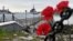 MURMANSK REGION, RUSSIA - JULY 2, 2019: Flowers left by mourners in the port of Severomorsk in memory of 14 Russian Navy officers who died in a fire on a submersible in Russian waters on 1 July 2019.