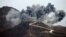 SOUTH KOREA --  A general view shows an explosion as part of the dismantlement at a South Korean guard post in the Demilitarized Zone dividing the two Koreas in Cheorwon, November 15, 2018
