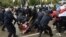 BELARUS -- Belarusian police and OMON officers detain students who march with the opposition flags to show their solidarity with political prisoners in Minsk, September 1, 2020