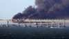 UKRAINE – Fire on the Kerch Bridge after an explosion on it. Ukraine, occupied Crimea, October 8, 2022 