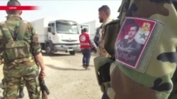 В осажденную Асадом Восточную Гуту прибыл первый гуманитарный конвой от "Красного полумесяца"