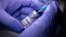 A vial labelled "Sputnik V Coronavirus COVID-19 Vaccine" and a syringe - generic