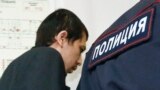 Russia -- Abror Azimov, a suspect over the recent bombing of a metro train in St. Petersburg, is escorted inside a court building in Moscow, April 18, 2017